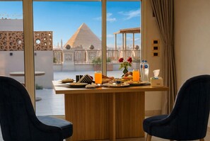 Panoramic Suite, City View | Dining - Pyramids Khan Hotel (Giza)