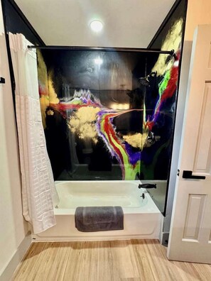 Shower, hair dryer, towels, shampoo