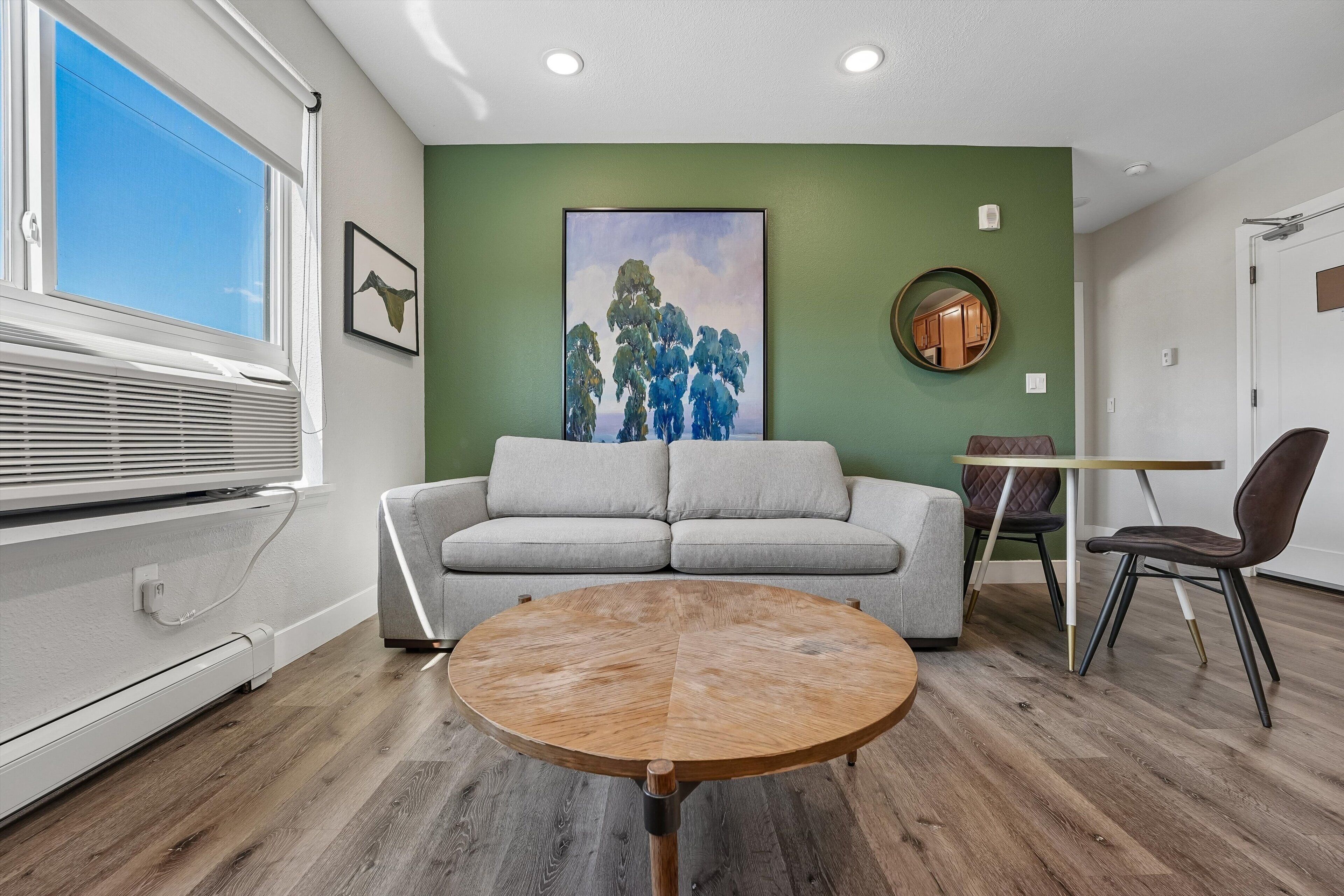 Two Bedroom, Queen Beds (Self Check-in) | Living area | 42-inch Smart TV with digital channels