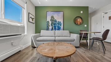 Two Bedroom, Queen Beds (Self Check-in) | Living area | 42-inch Smart TV with digital channels