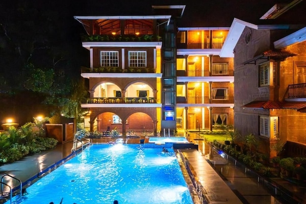 2 outdoor pools, open 7:00 AM to 10:00 PM, free cabanas, pool umbrellas