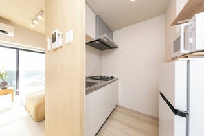 Twin Room | Private kitchen | Full-sized fridge, microwave, stovetop, cookware/dishes/utensils - SG Hotel Kinshai Hakata (Fukuoka)