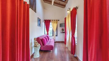 Deluxe Villa | Living area | Flat-screen TV