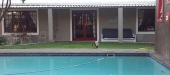 Arty self-catering cottage nestled in a tranquil garden with calming birdlife.