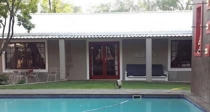 Arty self-catering cottage nestled in a tranquil garden with calming birdlife.