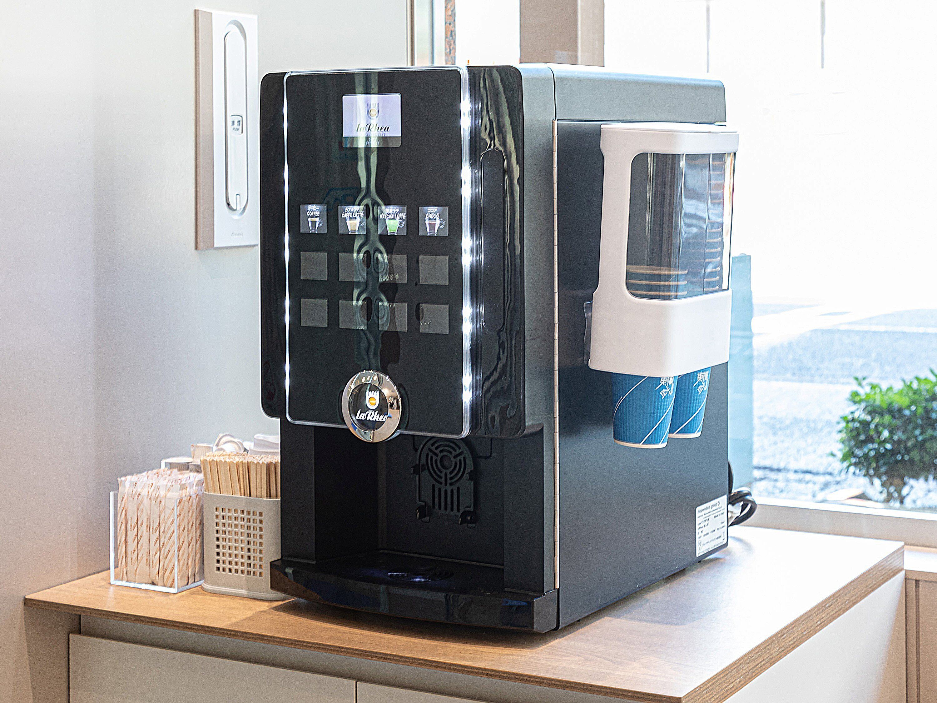 A coffee machine with multiple brewing options on a countertop.