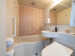 A modern bathroom with a bathtub, a sink, and a shower. - Toyoko Inn Ube-Shinkawa-eki (Ube)