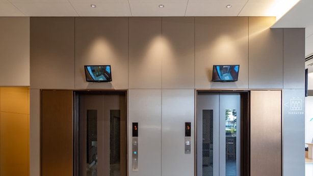 A modern elevator area with two elevators, each with a digital display and control panel. - Toyoko Inn Ube-Shinkawa-eki (Ube)