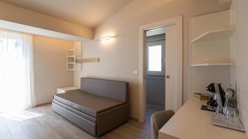 Chambre quadruple Deluxe | Aire de séjour