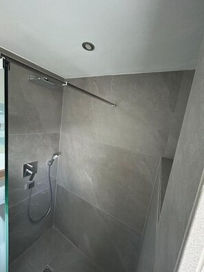 Shower, towels, soap, toilet paper