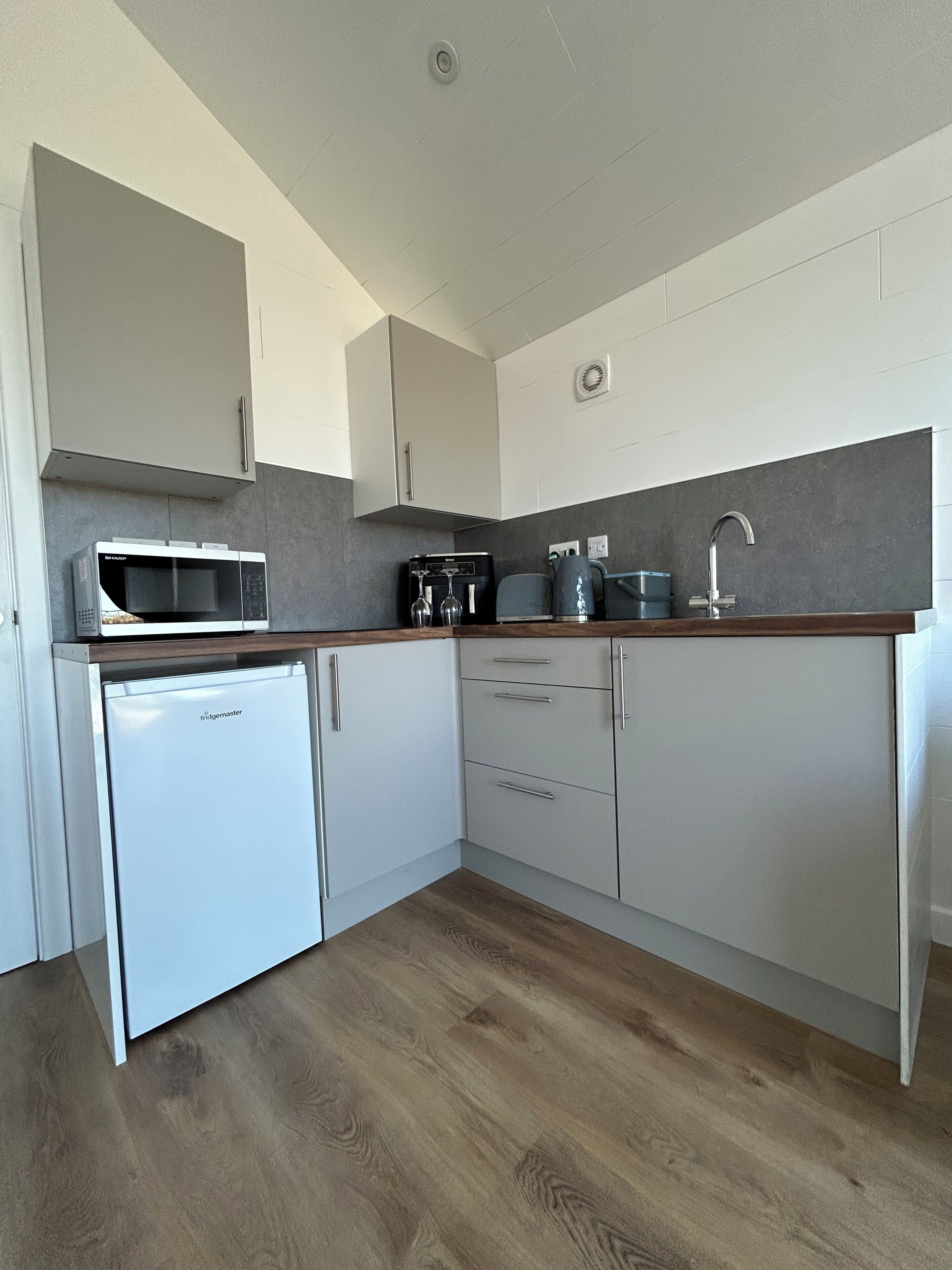 Fridge, microwave, electric kettle, toaster