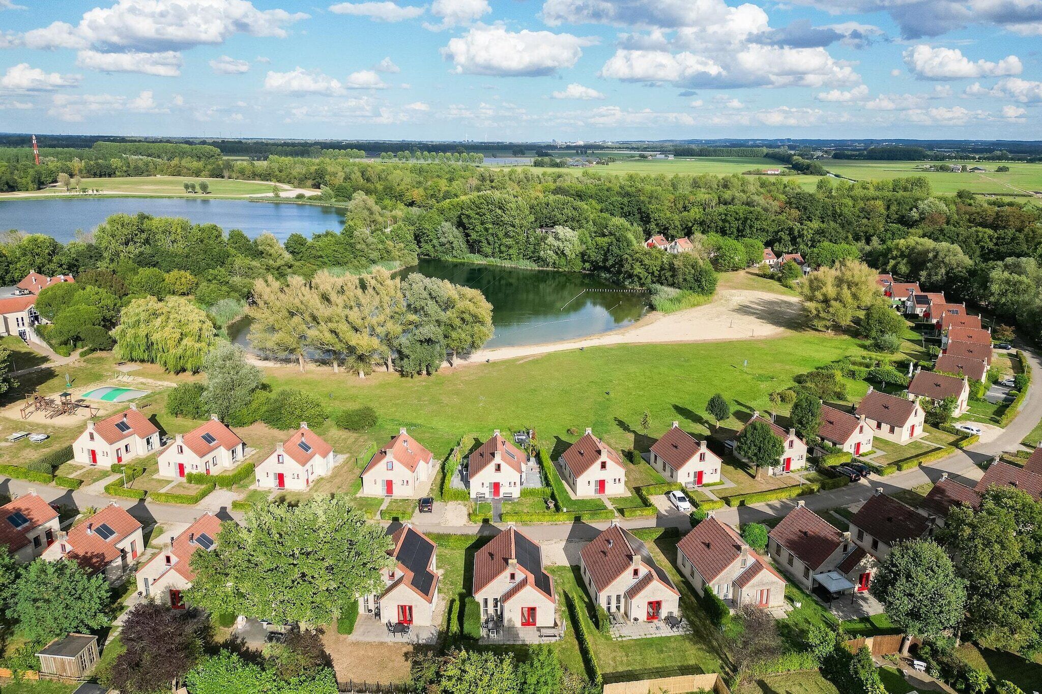 A residential area with houses, a lake, and a golf course.