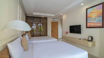 Deluxe Quadruple Room, Balcony | Minibar, desk, free WiFi, bed sheets