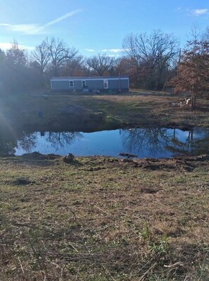 Property grounds - 3-bedroom mobile home in charming Mount Pleasant with AC. (Mount Pleasant)