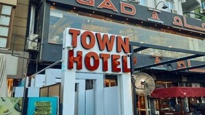 A multi-story building with a prominent sign for 'Town Hotel' and 'Gad Hotel' in both English and another language. - Town Hotel Hurghada (Hurghada)