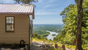A building with a view of a river and forest. - Cabin at the Gap | You Won't Believe the View! (Harpers Ferry)
