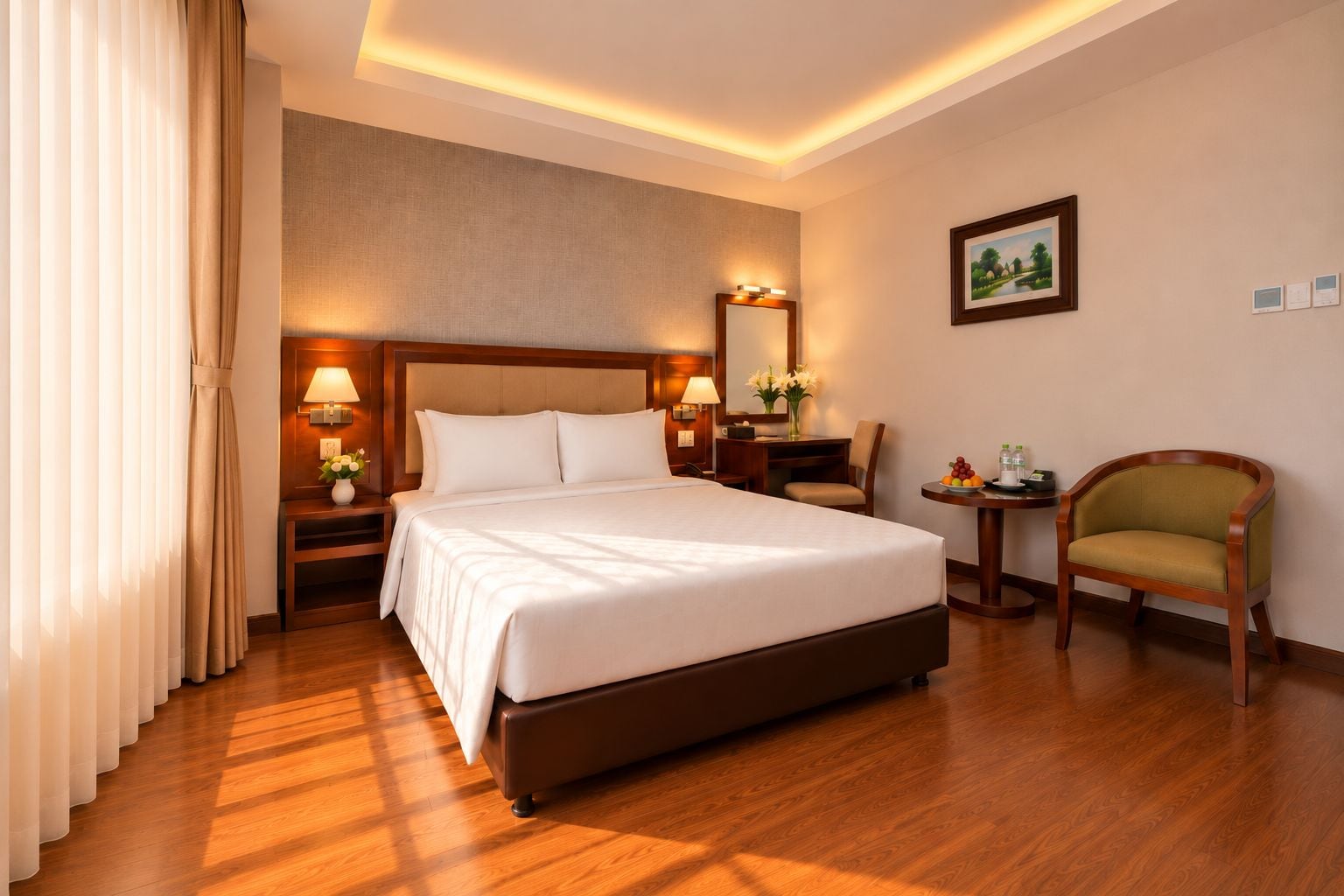 A hotel room with a large bed, bedside tables, a desk, a chair, and a painting on the wall.