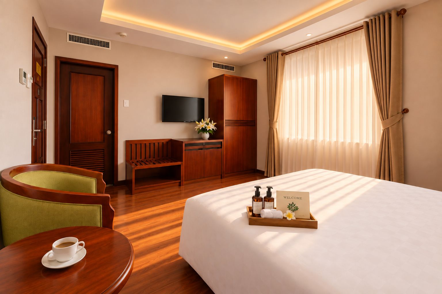 A hotel room with a bed, a desk, a chair, a TV, and a tray with toiletries.