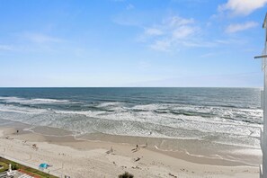 On the beach - Enjoy stunning ocean views from the balcony, living room, dining area, and kitchen. This 2BR condo features a heated beachfront pool, fitness room, king beds in both bedrooms, and comfortably sleeps 4 in beautiful Daytona Shores. (Daytona Shores)
