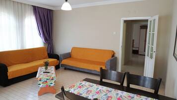 Comfort Twin kamer, balkon, uitzicht op tuin | Woonruimte