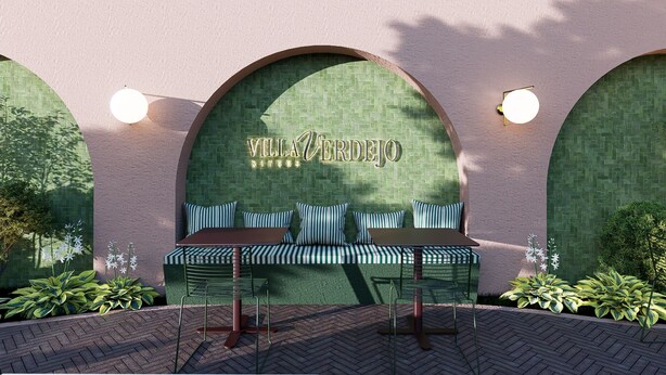 A seating area with a bench and chairs, a wall with a name sign, and two wall-mounted lights. - Villa Verdejo (Olivella)
