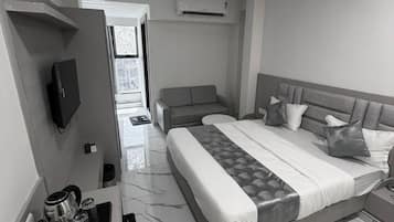 Deluxe Double Room, City View | In-room safe, desk, laptop workspace, iron/ironing board