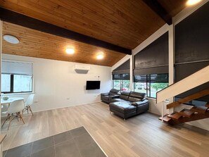 Living area - Comfortable Two-Storey Suites for Families and Groups (Taree)