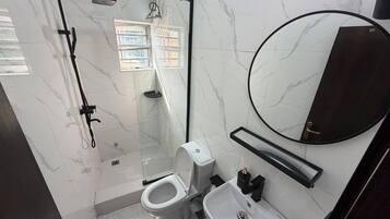 Economy Apartment, Balcony, City View | Bathroom | Free toiletries, hair dryer, towels, soap