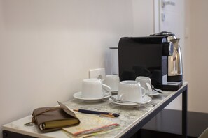 Junior Triple Room, City View | Coffee and/or coffee maker