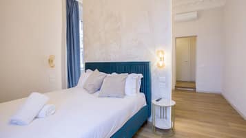 Luxury Quadruple Room, City View | Minibar, in-room safe, desk, blackout drapes