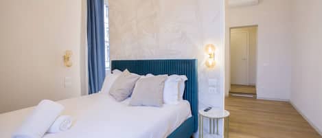 Luxury Quadruple Room, City View | Minibar, in-room safe, desk, blackout drapes