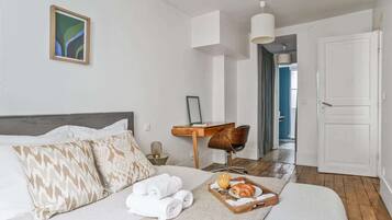 1 bedroom, desk, iron/ironing board, travel crib