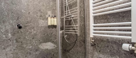 Shower, hair dryer, towels, shampoo