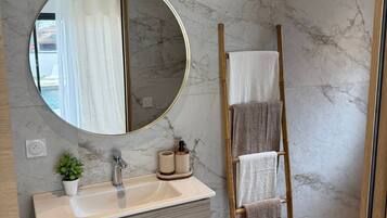 Shower, hair dryer, towels, soap
