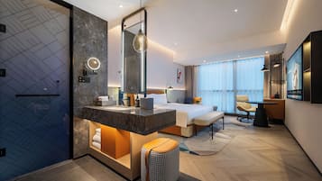 Premium bedding, memory foam beds, free minibar items, desk