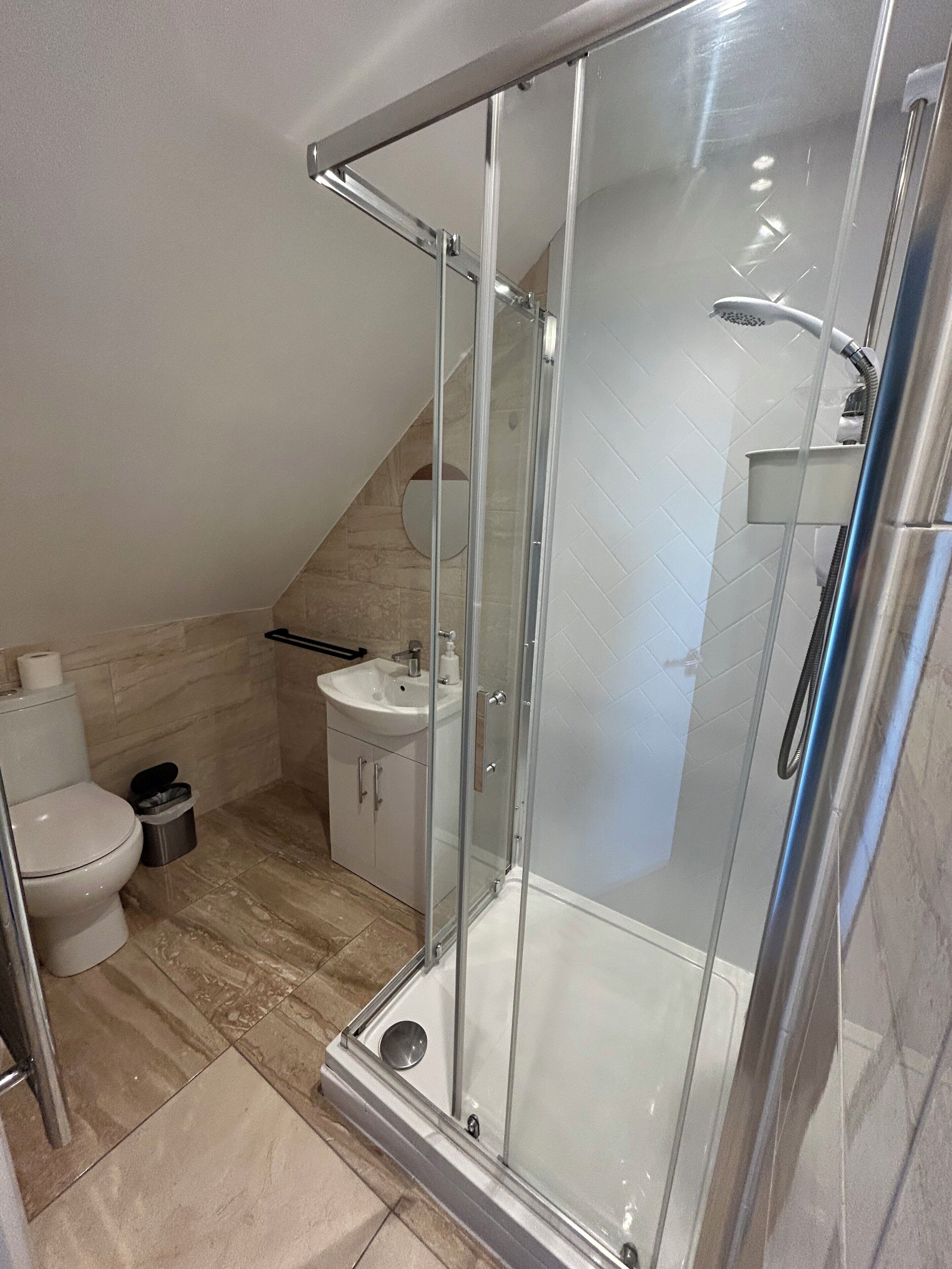 Shower, hair dryer, towels, soap