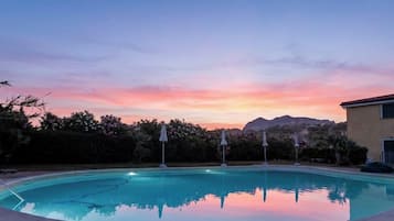 Seasonal outdoor pool, pool umbrellas, pool loungers