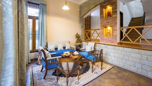 A living room with a sofa, chairs, a coffee table, and a fireplace. - Alaya Stays Mehar Villa 3BHK With Garden (Kasauli)