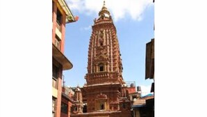 A temple with a tall, intricately carved tower. - 
Charming Newari-modern homestay in Patan, cozy stay near heritage sites (Lalitpur)