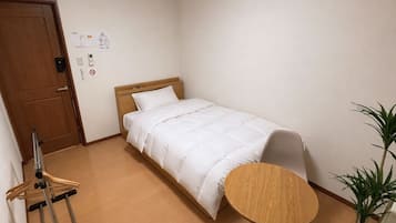 Basic Single Room | Blackout drapes, bed sheets