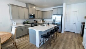 Coffee/tea maker, fridge, microwave, oven - Welcome to The Velvet Spur, a thoughtfully designed western retreat where elevated comfort meets effortless style. Nestled in Eagle,  across from Eagle Island.  This home is your perfect home base for relaxing and exploring, (Eagle Boise)