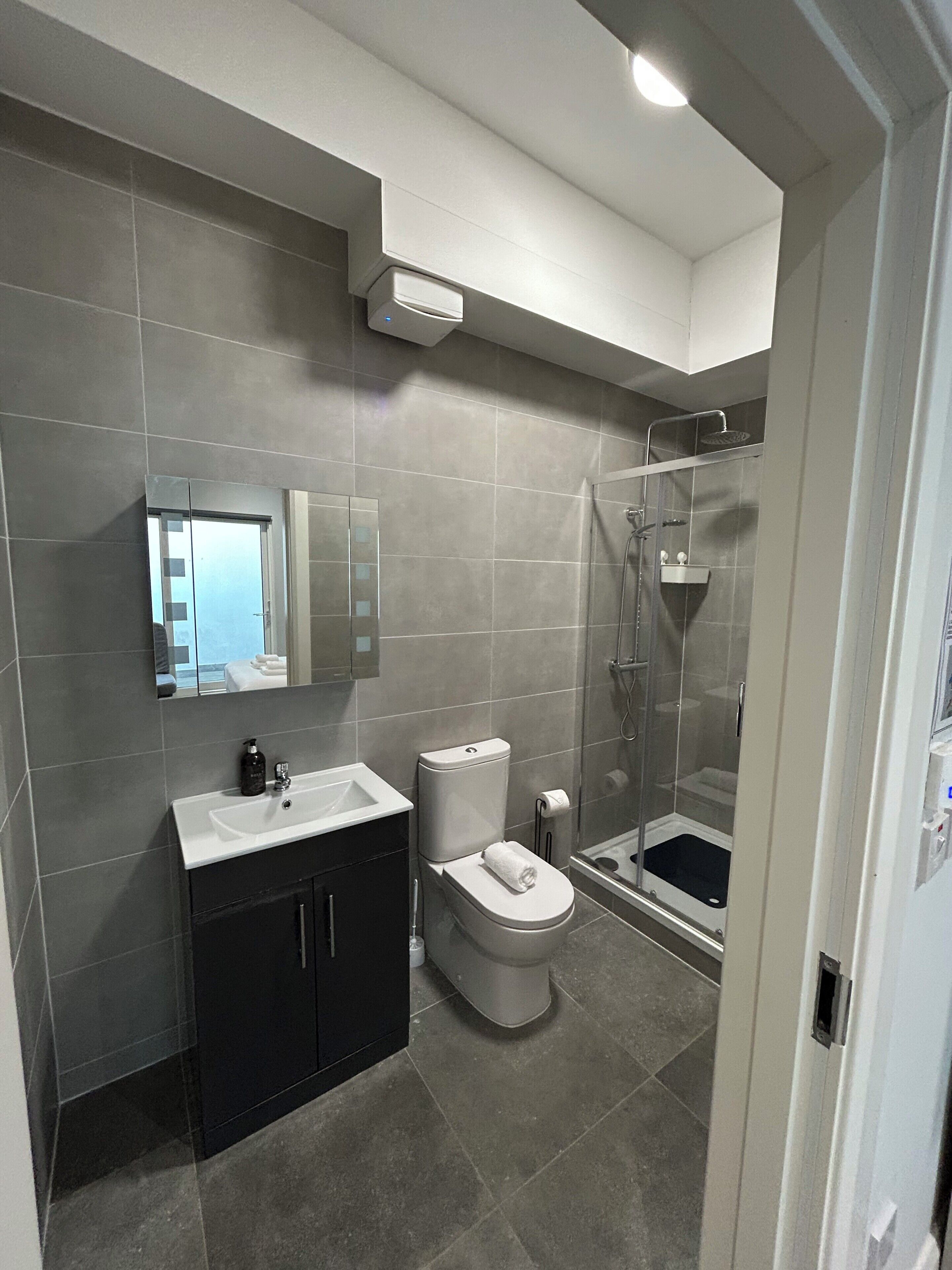 Shower, hair dryer, towels, soap