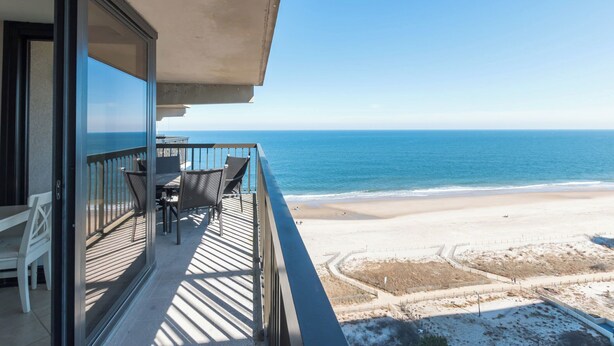 A balcony with a view of the beach and ocean. - Ocean City's Premiere Building (Ocean City)