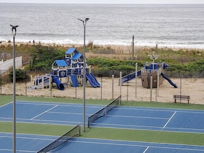 A beachside tennis court with a playground and a view of the ocean. - Ocean City's Premiere Building (Ocean City)