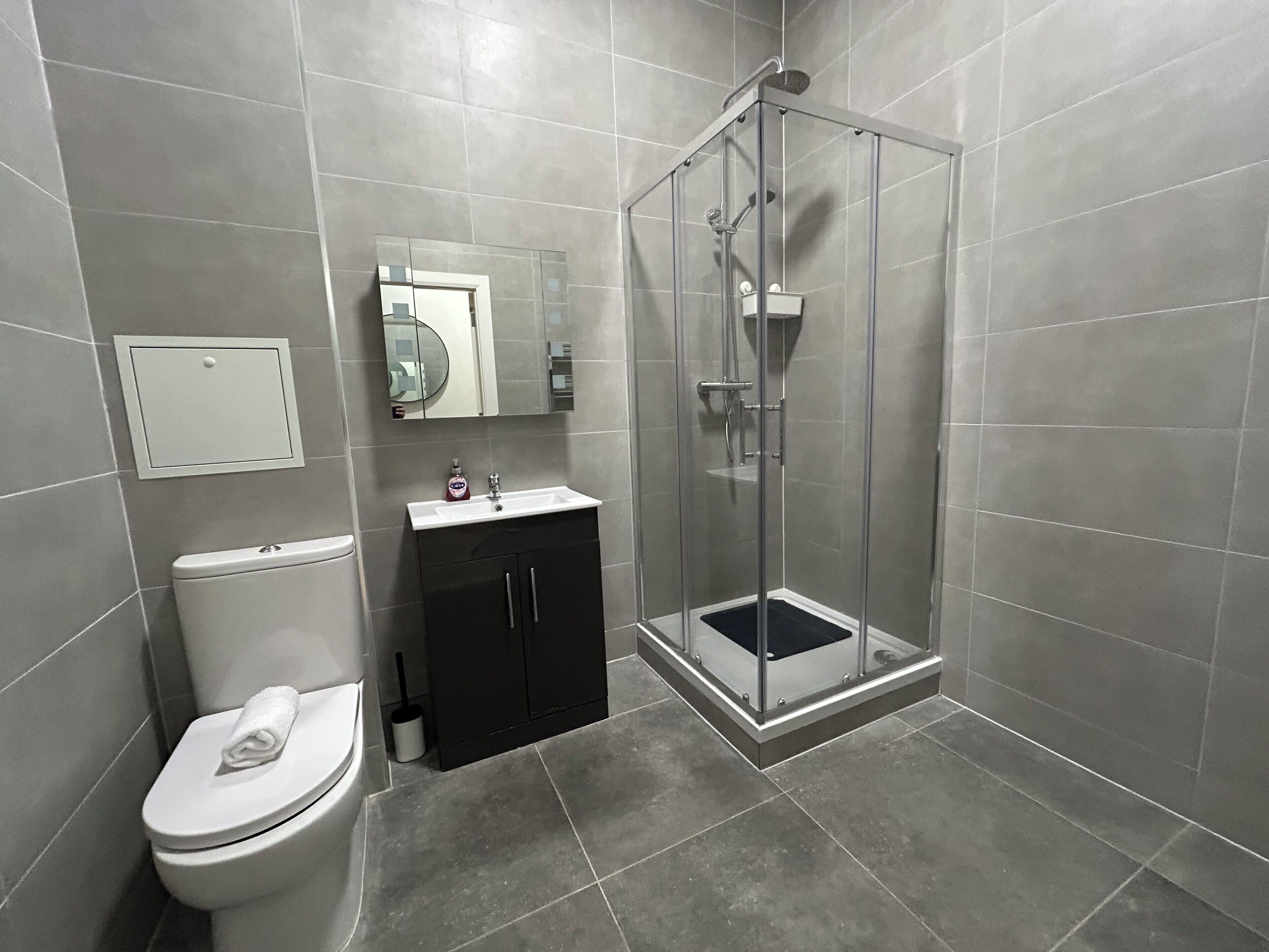 Shower, hair dryer, towels, soap