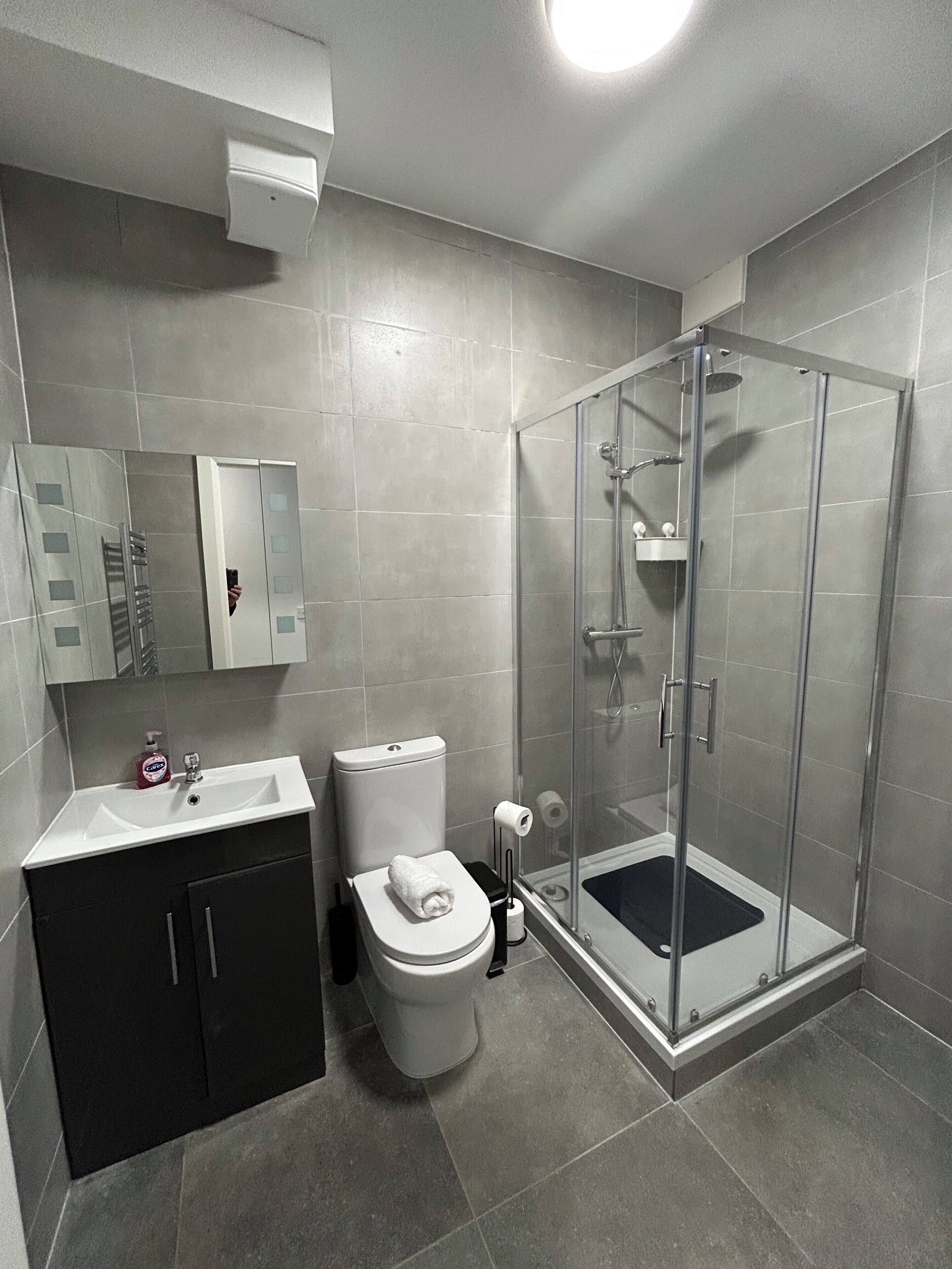Shower, hair dryer, towels, soap