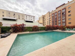 Pool - A studio in Salamanca, Madrid's most elegant quarter, where a sectioned-off sleeping area creates a flexible home with its own balcony and a shared pool for summer afternoons. (MADRID)