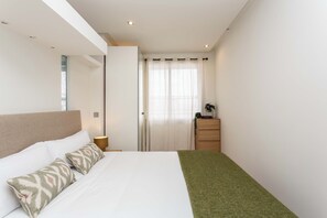 Room - A studio in Salamanca, Madrid's most elegant quarter, where a sectioned-off sleeping area creates a flexible home with its own balcony and a shared pool for summer afternoons. (MADRID)