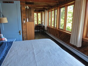 A room with a bed, a desk, and a window with curtains. - Waterfront 3-bedroom Lake Rescue house for your getaway (Ludlow)