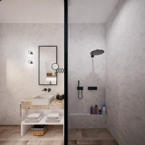 Een douche, handdoeken, zeep, shampoo